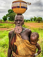Click image for larger version. 

Name:	african-tribe-mursi-with-big-lip-plate-carrying-her-EW3D1H.jpg 
Views:	16 
Size:	167.3 KB 
ID:	24668