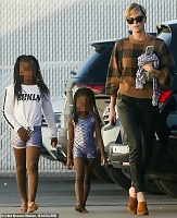 Click image for larger version. 

Name:	Theron_stepped_out_in_a_caramel_sweater_with_a_b-a-39_1572668744117.jpg 
Views:	326 
Size:	93.4 KB 
ID:	9584